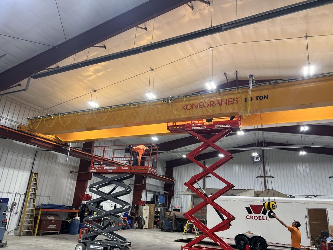 Commercial shop build-out with overhead crane and high-bay lighting